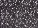 Bavlněná látka v metráži s motivem bílých hvězdiček na černém podkladu, pro šití Vašich výrobků.